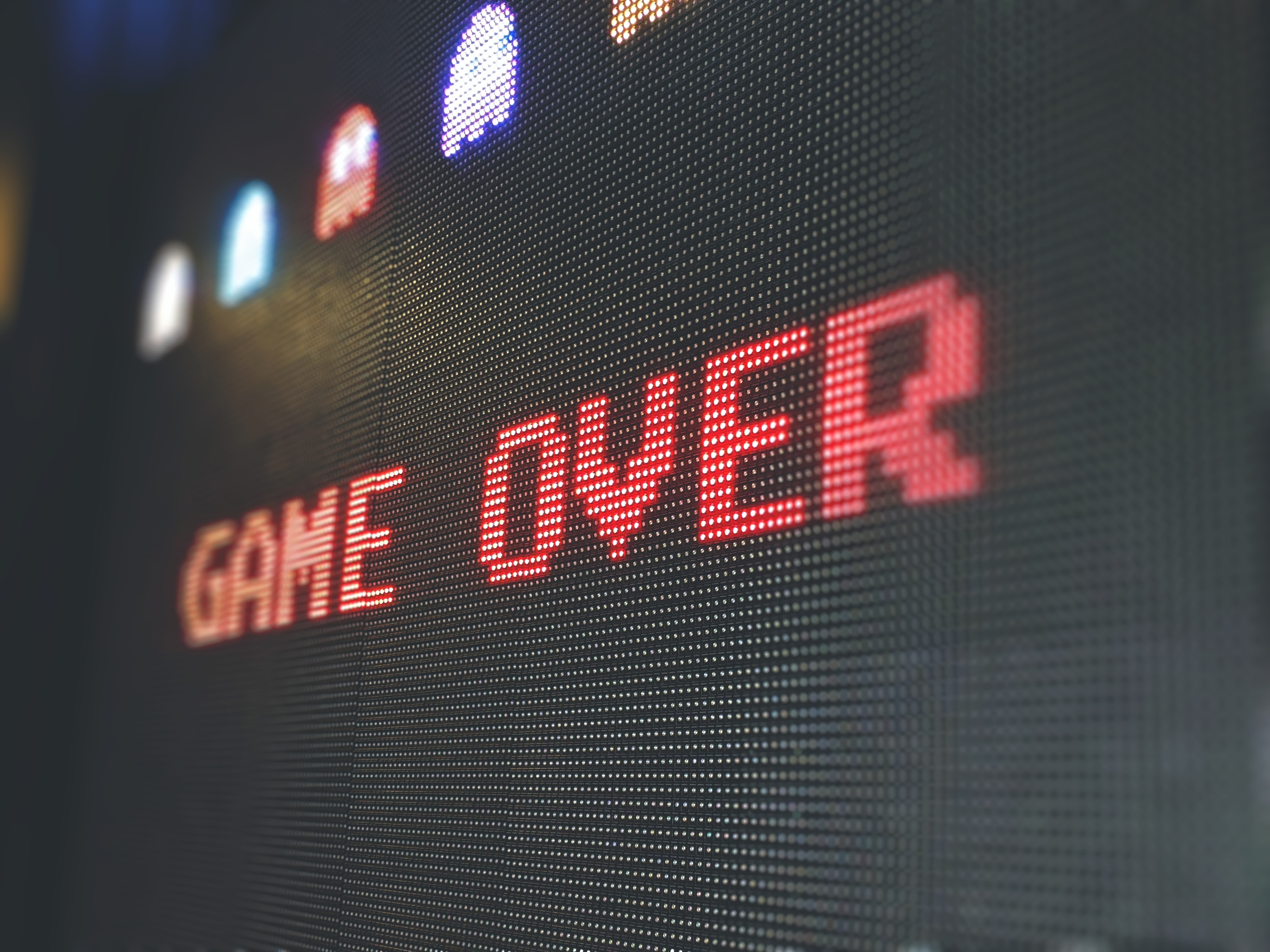 Retro video game font saying "Game Over" displayed on screen