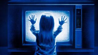 Carol Anne gets too close to the TV in Poltergeist 