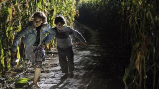 The kids of A Quiet Place run for their lives through a cornfield at night